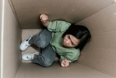 A woman anxiously trapped in an enclosed space